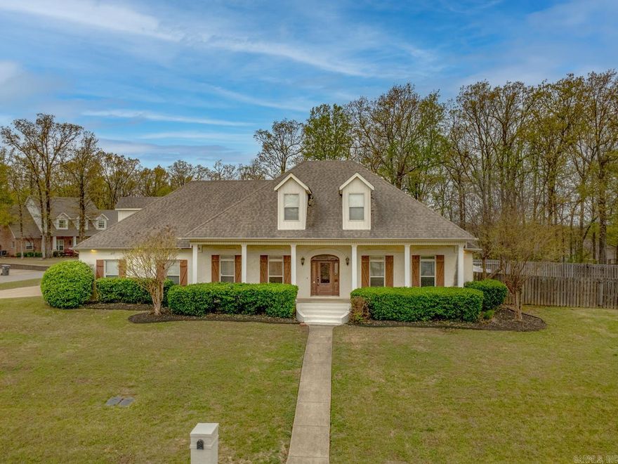 Welcome to 4405 Wood Crest Drive in Lake Crest Estates - Jonesboro, Arkansas. Located in the Valley View School District, this 4-bed, 3.5-bath home offers over 3,800 sq. ft. of living space with classic brick colonial style. The main-level primary suite includes a sitting area, large closets (his and hers), a spacious bath with whirlpool tub, and walk-in shower.  The master suite is separate from the three other bedrooms on the same level. The kitchen features freshly painted cabinets and ample cabinet space. An island with an extra sink makes this kitchen a stand out! With an eat-in breakfast bar, the heart of the home opens to multiple living areas, including a formal dining room, great room, and office.Upstairs is a perfect area for office, game room, or living area and has an extra room. Situated on a corner lot, the home offers added privacy and a lake view from the front porch. The backyard is a private escape that includes an in-ground pool, patio, and big screened porch with fireplace. Additional features include a two-car garage, golf cart garage, and extra parking pad. Sellers offering a $3,000 carpet allowance with reasonable offer. Schedule your showing today!