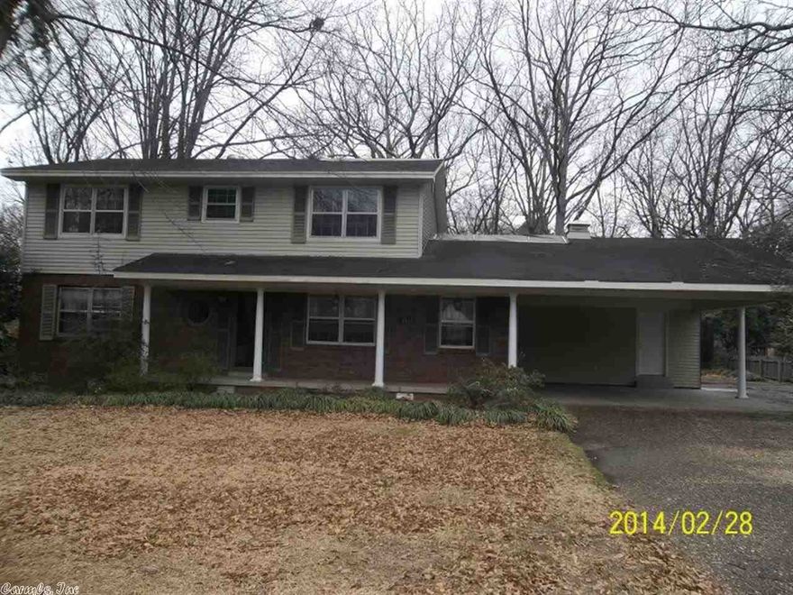 This would make a great home for a family with some remodeling & a new roof. Has a large backyard with large deck & located across the street from the lake. Mature trees a great neighborhood. See agent remarks!