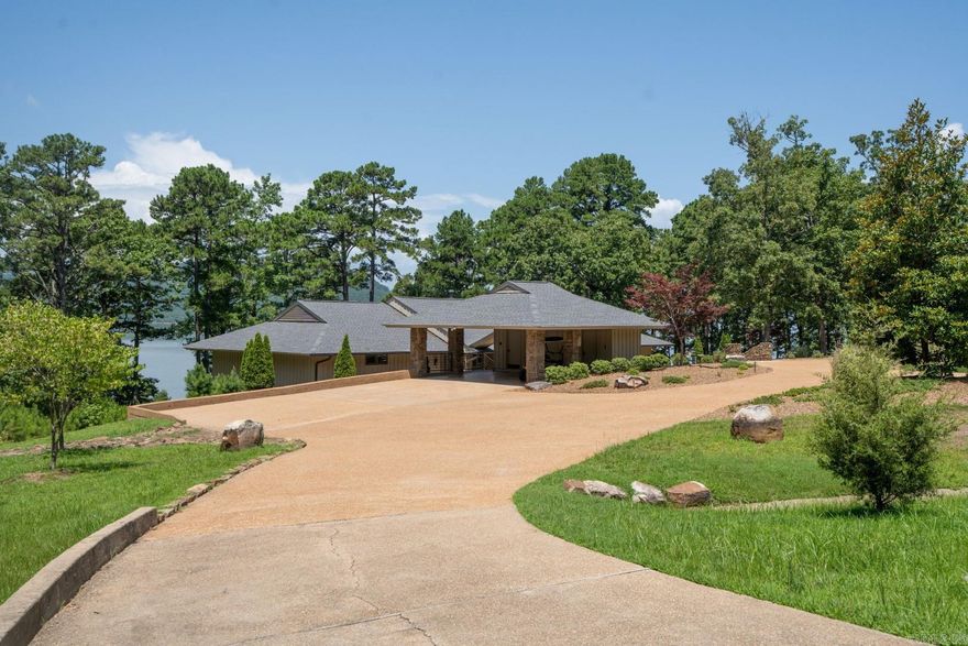 Eden Isle ESTATE!  This is probably the largest piece of land on Eden Isle, with the only exception being undeveloped acreage.  The lovely 3-bedroom, 2.5-bath FURNISHED home has some of the best lake views on the island!  Also, walking the water is a gentle slope and easy!  Completely remodeled (since 2019) by the current owner; design and furnishings by Scott Paterek with Massimo Interior Design out of Little Rock.  The house sits on 2.56 acres and there is a buildable vacant lot next door that's 1.04 acres!  Open concept living/kitchen/dining with cathedral ceiling and stone fireplace.  Walls of glass overlooking Greers Ferry Lake!  A house and spot you just have to see to appreciate it...definitely one of the most incredible properties on Eden Isle!  Old survey is attached...the property lines are accurate, the driveway is not accurate.