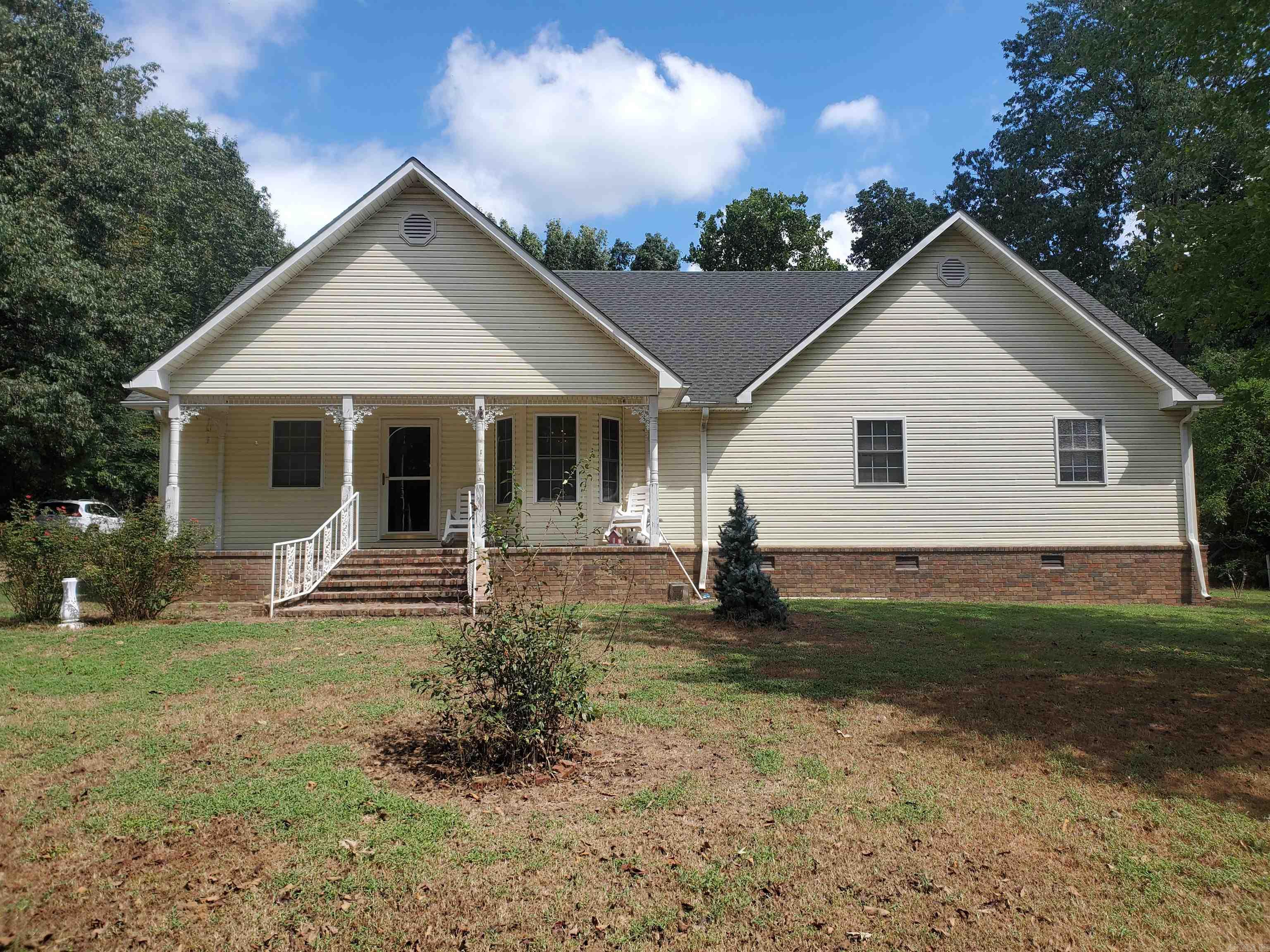 1377 W. Court St., Piggott, AR 72454 Tucked away on 4.48 secluded acres, this beautiful 4-bedroom,2-bath home offers space, privacy, and convenience all within city limits. Built in 2004, the home features 2,100 sq ft of living space with an open layout, a spacious kitchen, and a large primary suite with private bath. Whether you're looking for room to grow, space to relax, or a peaceful retreat close to everything, this property delivers. Plenty of land for a shop, garden, or just to enjoy the quiet outdoors. A rare find in Piggott don't miss your chance to own this private in-town retreat