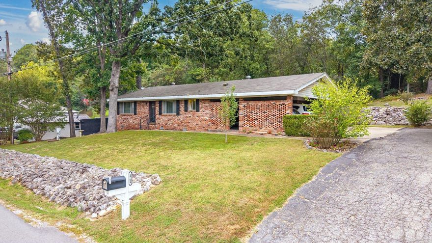 Across from Lake Hamilton with views, value & vacation vibes! This 2-Bedroom 2-Bath, brick charmer is all-electric (natural gas available nearby), has a 4-year-old roof, 4-year-old HVAC, 5-year-old water heater, new LVP in the kitchen & guest bath, a large pantry, 2-car carport, and a level backyard (which is a rare find in this area).  Join the optional POA ($50/yr) for lake access, boat launch, and picnic area—without lakefront prices! Located in the county, no short-term rental permit needed—perfect for an investor, first-time buyer, or weekend lake escape.  Homes like this don’t come along often—especially with lake views, usable land, and a price that leaves room in the budget for updates. Bring your vision and make this classic your next success story!
