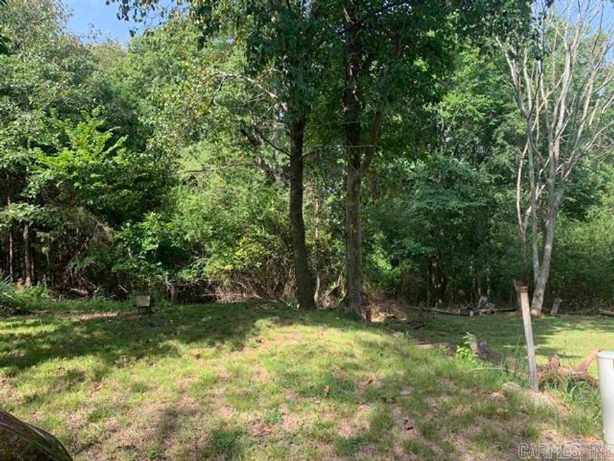 Property listed are lots 12 & 13 being sold together. Both lots together are a total of 60 x 130.  These are vacant city lots with city electricity, water, gas, and sewer available. Lots are up on high end of a dead-end street.  The property is just minutes from downtown Hot Springs area shops, eateries, Bath House Row, the Hot Springs, Oaklawn Race Track, and other downtown activities. Great area for a small home/bungalow style for low maintenance living or a rental.   No mobile homes allowed