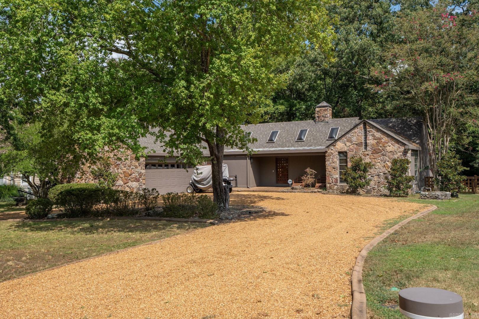 This 3-bedroom, 3-bath 1-level home on Ridge Road at Eden Isle is in perfect condition! Open Living, kitchen and dining, the entire back of the house is ceiling to floor glass, split bedroom floorplan, 2-car garage with separate heating and cooling for additional "fun space", very private backyard with lots of landscaping and sprinkler system, vaulted ceilings with large stone fireplace. New roof in 2024, new exterior paint in 2025! Home sits across the street from the Red Apple Championship Golf Course!