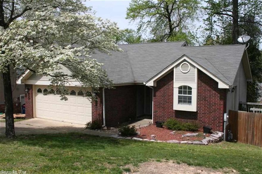 Super cute, updated tri-level house!  This house has updated fixtures, laminate flooring, & stainless steel appliances!  The kitchen is open to the dining area with french doors out to the deck.  Perfect for entertaining!  Downstairs is the living room with huge window overlooking the large backyard.  Also downstairs is the laundry room & master bedroom.  Upstairs are 2 guest bedrooms, a bathroom, & an office!  In 2010 it got a new roof, tile, & carpet. New AC/Heat in 2011. Come see this one today!