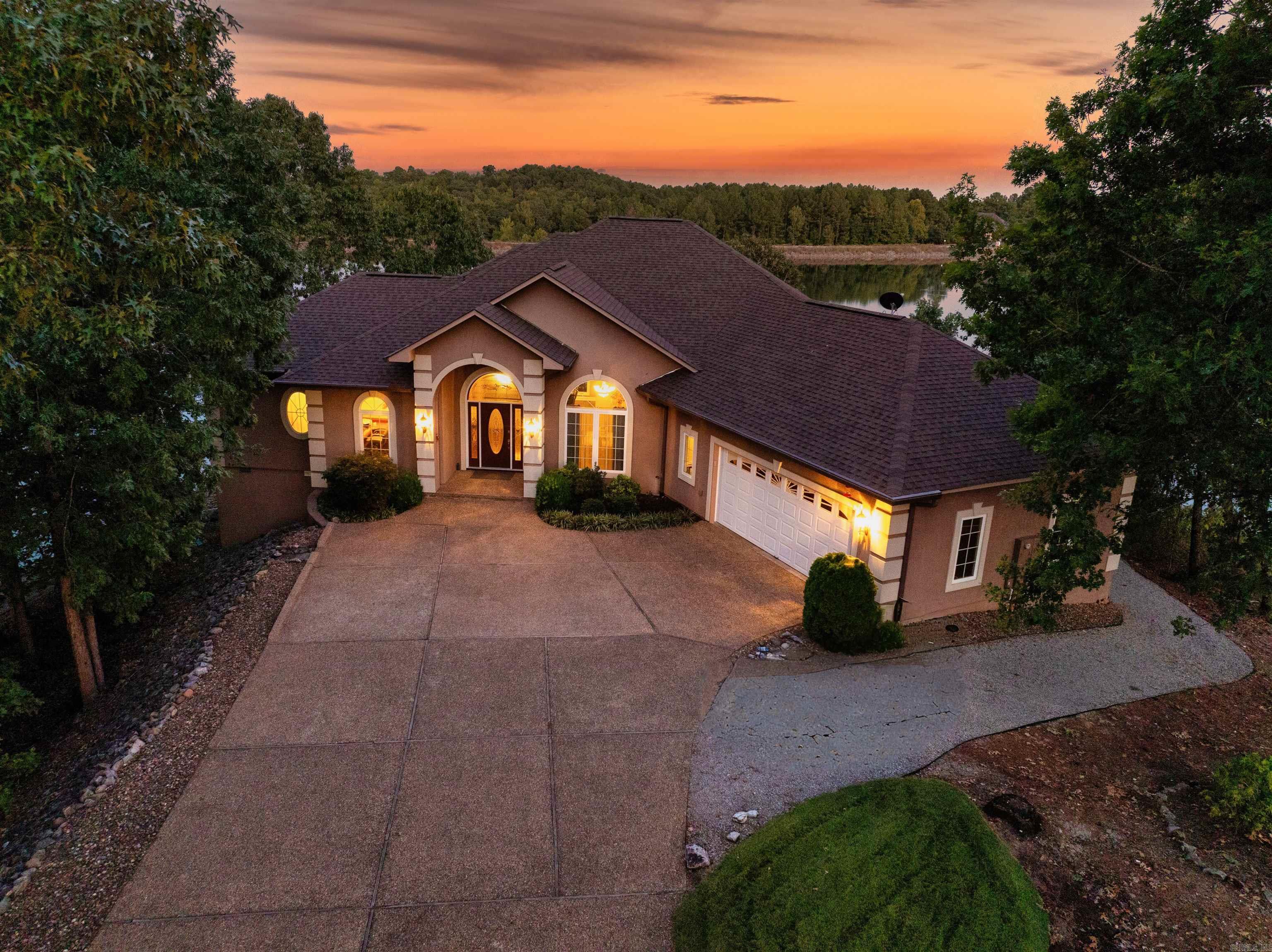 Spacious Lake Front Home on Lake Granada with 339' of lake frontage and seawall ! Walk through the large entry and enjoy the beautiful lake views from all living areas in this one owner custom built home. Entry level includes two bedrooms, kitchen, dining and breakfast area. Separate office off entry. Kitchen with granite countertops, breakfast bar, wall oven, built in microwave, dishwasher and lighted panty. New refrigerator to convey. Kitchen island with Separate wine bar. Spacious laundry room with utility closet. Primary bedroom with access to deck. Primary bath with dual sinks, tile floor, walk in shower, separate jetted tub, toilet room and large closet. Guest bedroom apart with access to separate deck. Lower level with two bedrooms and one bath. Living area lower level with patio access. Lower level also includes heated and cooled workshop not included in square footage. Spacious Garage large enough to park 2 full size cars and 2 golf carts. Outdoors enjoy the spacious landscaped yard with flagstone patio, boat dock and swim dock. New Roof 2024 Total square footage not included in tax records. Buyers are encouraged to measure. Pets Agents see remarks.