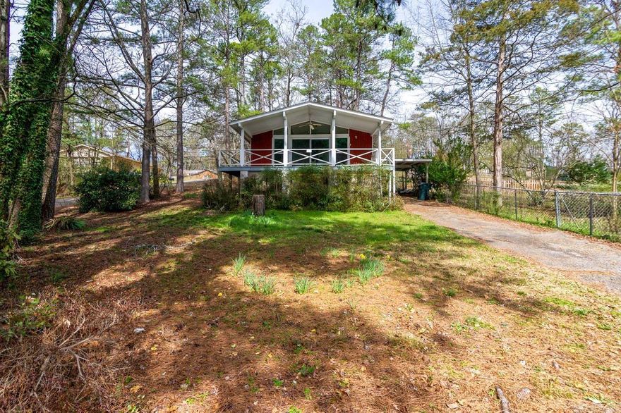 Come live by the water! The front deck is an awesome place to drink your morning coffee. This cottage has 2 beds/1 bath, open concept living area with vaulted ceiling, carport, newer vinyl windows, newer roof and HVAC. With a little TLC and updating it will be a showplace! To be sold as is, but inspections are welcome. SF is estimated. No disclosure available. Agents-please see remarks!