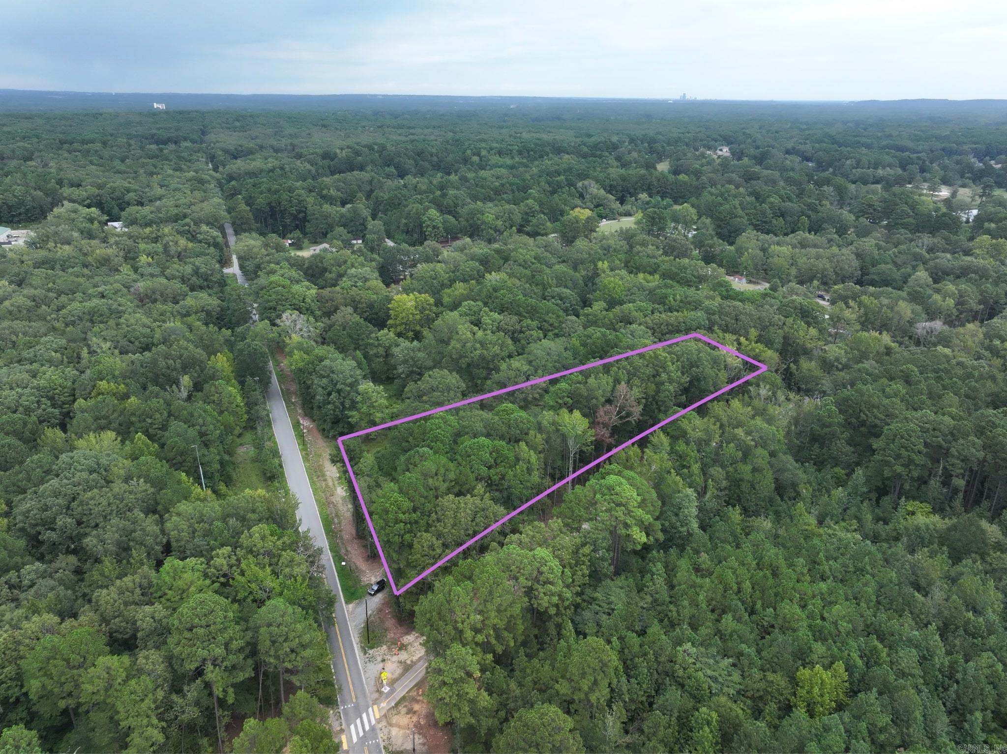 Wooded 3-acre lot w/easy commute to Little Rock or Bryant/Benton. Located next to the newly refurbished/paved rail trail for convenient walking/running/biking activities.
