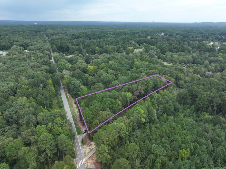 Wooded 3-acre lot w/easy commute to Little Rock or Bryant/Benton. Located next to the newly refurbished/paved rail trail for convenient walking/running/biking activities.
