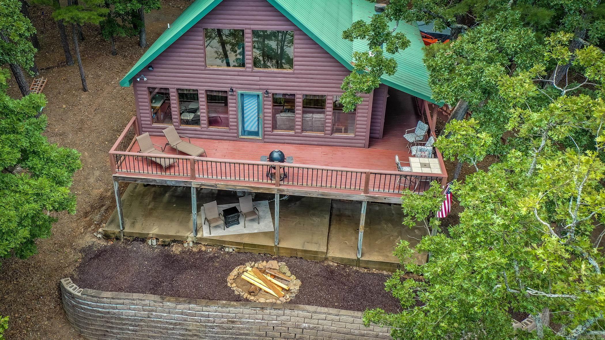 This charming lakefront property is the perfect retreat for anyone looking to escape the hustle and bustle of everyday life. With a cozy loft, two bedrooms, and a spacious deck overlooking Greers Ferry Lake, you'll feel like you're on vacation every day. Plus, with 2 acres of land to explore and easy access to the water, you'll never run out of things to do. Don't miss out on this opportunity to make this peaceful oasis your new home. Contact us today to schedule a showing! Had to change address. County informed me its 1022 and not 922. AR County data is incorrect and they have sent it over to be changed.