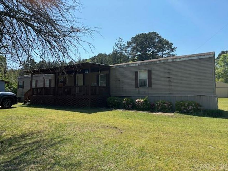 Has a barn & metal building on property.