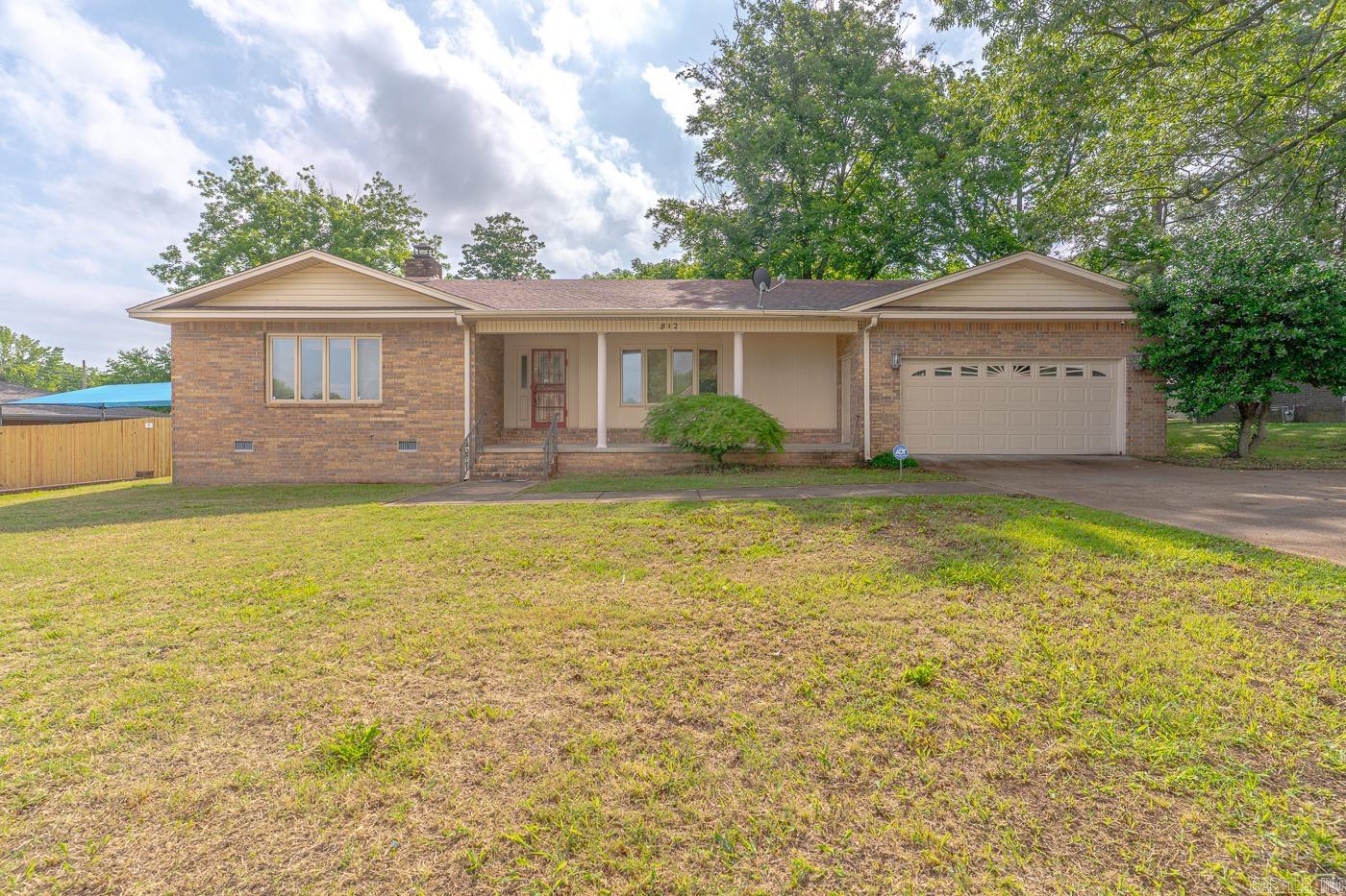 Investment opportunity! Whether you’re looking to expand your portfolio or find your next home, 812 Glendale St. in the heart of Jonesboro, AR is a must-see opportunity. This 3-bedroom, 2-bath brick home offers approximately 1,989 sq ft of living space plus 600 sq ft in the basement—perfect for storage, a bonus area, or future expansion. The property features a fireplace, formal living and dining rooms, a spacious backyard with a deck, and a 2 car garage. Sitting on approximately +/- 0.27 acres, it’s ideally located with quick access to schools, shopping, and everything Jonesboro has to offer. Seller is open to various financing options, making it even easier to take advantage of this great investment. Call today to schedule your showing and explore the potential of 812 Glendale!