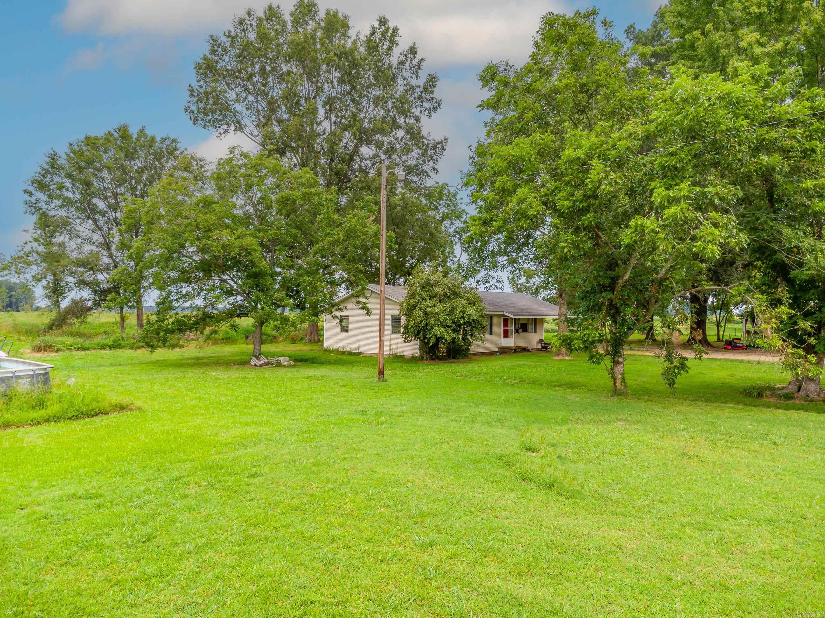 A lovely old farmhouse, kept in great shape, is set on excellent hunting grounds. The property covers 118 acres, with 55 acres of hardwood trees. You could replant pines for future income or prepare the land for farming. Live in the house or rent it out for extra cash while using the land for hunting or other income-generating activities. How would you make the most out of this vast property?