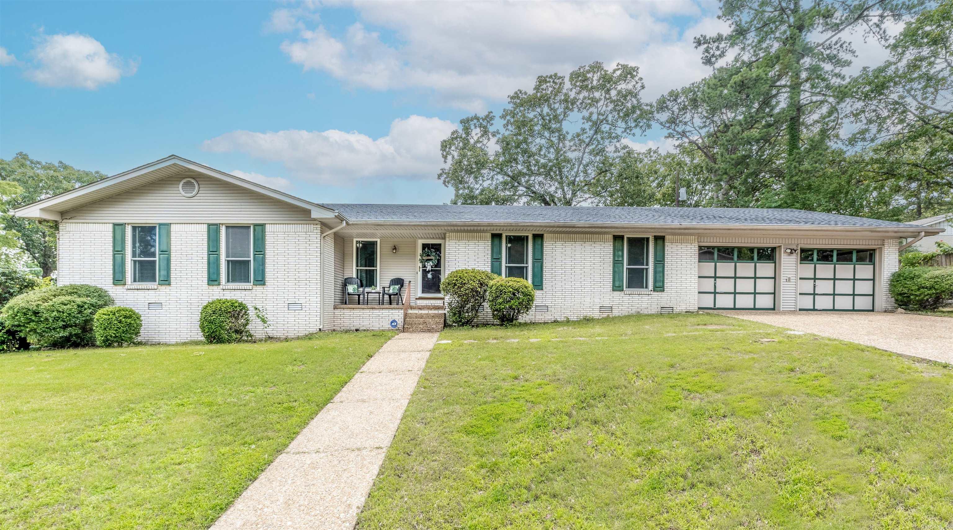 This spacious 4 bedroom 2 bath home is located in the highly desirable Lakewood neighborhood, conveniently located near all the amenities you need. There are two living areas plus a bonus room that offers many possibilities. These rooms have built ins and tons of storage. The oversized primary bedroom has plenty of room for a sitting area, two walk-in closets and an ensuite bathroom. There is a large laundry room with a double sink. You can sit on your front porch and enjoy your neighborhood or relax in your private backyard under the covered back patio. More storage is available in a larger utility building located in the backyard. The two car garage has a storage closet, shelves and a partially floored attic. The garage/workshop below the home is a perfect place for a hobbyist. There is also a FEMA approved safe room located in this room. The home has a newer roof and dishwasher. The home is being sold "As Is" ***Please see Agent Remarks***