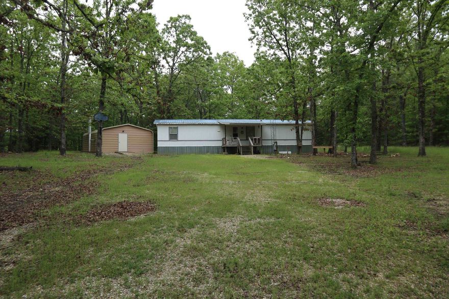 COUNTRY HOME & ACREAGE FOR SALE NEAR GLENCOE ARKANSAS  Property located at TBD Country Spring Rd, Glencoe, AR. This 3 bedroom, 1 bath mobile home has approx. 784 sq. ft. of living area. It has central heat, wall A/C, carpet and vinyl flooring, range and refrigerator. It sits on 3 mostly wooded acres with county road frontage. It has rural water and private septic system. High speed fiber internet available through NEXT. It also has a 20 x 30 shop building with concrete floor. Real estate taxes for last year were $150.75. Property located within 45 mintues of Lake Norfork.