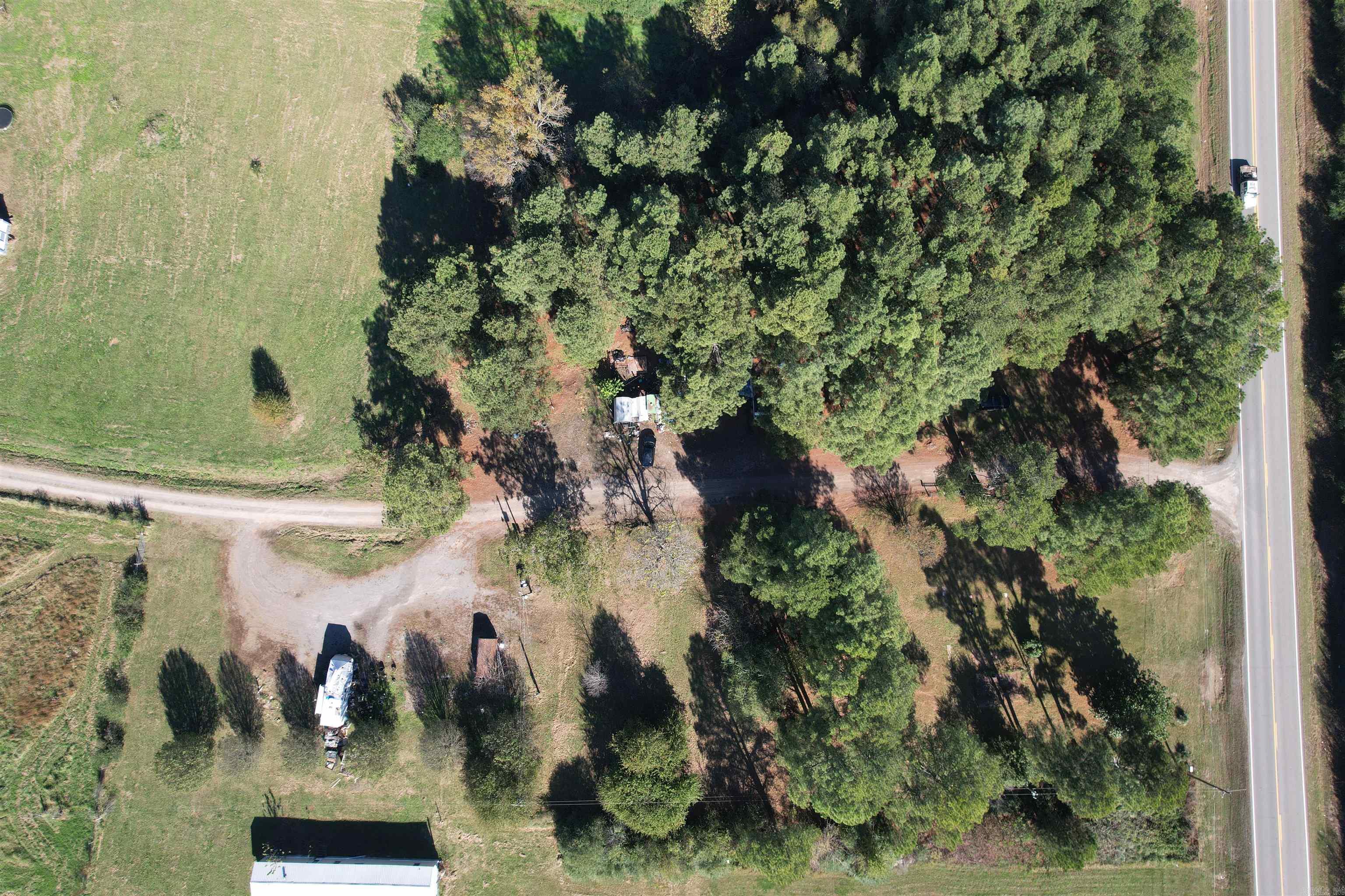 RV park contain 11 spaces/hookups; 3 septic tanks; water on 1 meter, 2 electric meters; seller pays for water, electric and trash. Taxes will need to be REassessed and are only an estimate.