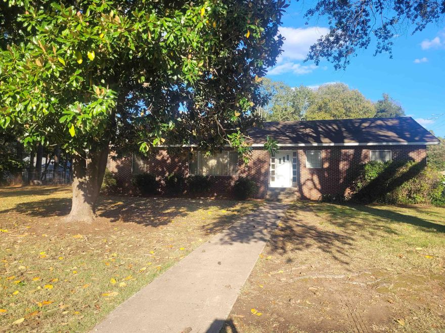 This home features brand new flooring in the kitchen and sunroom! A kitchen remodel and new HVAC unit in 2020. Solid hardwood floors throughout the house. Formal living room, formal dining room, with a HUGE eat-in country kitchen that has 34 cabinets and 21 drawers! Home office to the side of kitchen (could also be a bedroom), three bedrooms, 3 full bathrooms, 3 hall closets, sunroom and laundry room combo, that leads to the back yard with an ingrown pool. Pool has a ramp for easy access. A HUGE walk-in cedar closet, closed in garage contains the third full bath and would make a wonderful den, guest room, or mother-in-law quarters. This lot is 1/4 block, fenced backyard for pets or garden, gazebo conveys, shed/garage/workshop beside driveway. Easy commute to Little Rock or Stuttgart. Come and see it today!