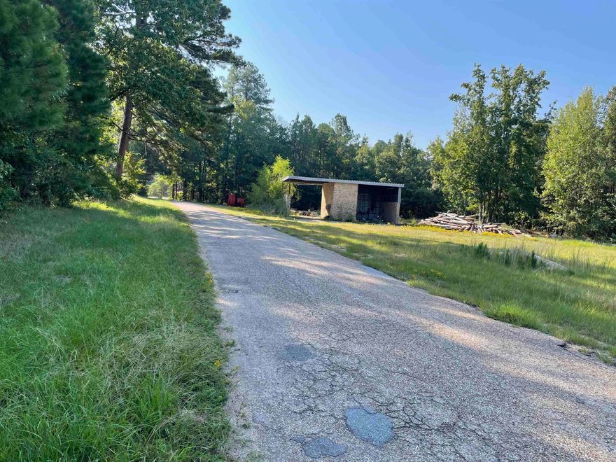 A great place for a small business.  Property is a corner lot, paved road with highway frontage. There was once a two-bay car wash on this property but it is just being used for storage currently.  The acreage does have utilities on it.