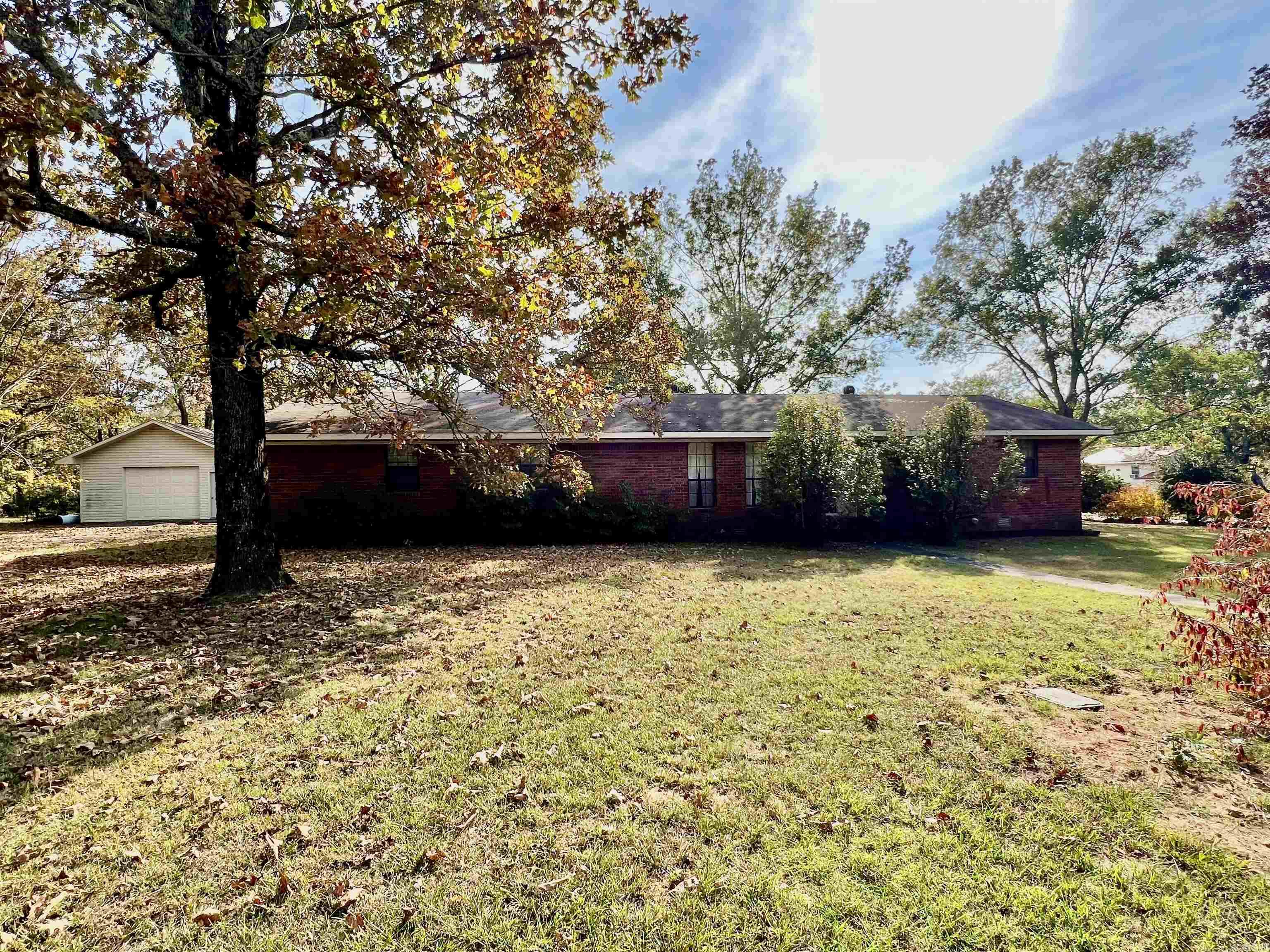If your looking for a little piece of country, this one is it. Home features 3 bedrooms, 2 baths. Spacious living area with hardwood floors. Eat-in kitchen with ample counter and cabinetry space. Separate laundry room, plenty of sunlight in sunroom on back of home. Detached 20x30 shop with concrete floors and overhead door. All located on 0.65 acres with plenty of shade trees. Measuring encouraged as sunroom was added on. Call today for your personal tour. SEE AGENT REMARKS!