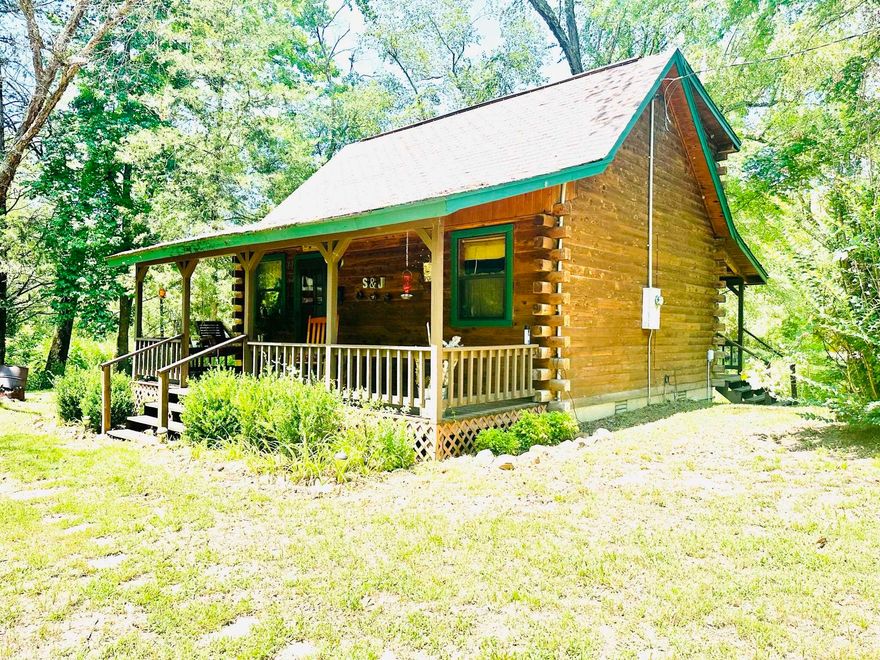 Country Log Home with Creek Frontage and Breathtaking Ozark Mountain Views!  Welcome to your dream retreat in the heart of the Ozark Mountains! This property spans approximately 2 acres, with a year-round creek nestled in Millcreek. This charming 1 bedroom, 1 bath log home provides you with the perfect combination of rustic charm and modern comfort.  Imagine relaxing in your cozy log home while listening to the creek flowing, just steps away in your backyard. The home features 620 square feet of living space. With a thoughtful layout and smart design, the cabin provides an ideal space to retreat and recharge. Another highlight of this property is the large front and back porch, perfect for savoring your morning coffee while soaking in the breathtaking views of the Ozarks. Whether you want to host a barbecue or enjoy a quiet moment with a book, these porch spaces will undoubtedly become your favorite spots. This beautiful property is listed for $149,900! Call today to schedule a viewing.