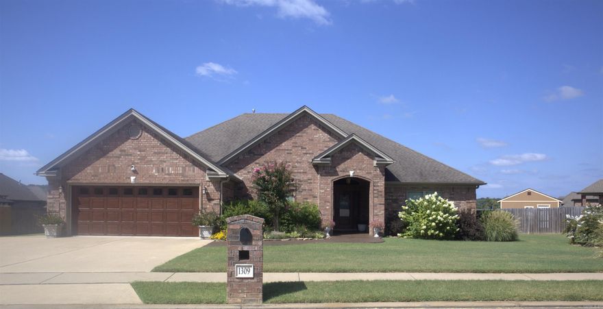The Best Back Yard in Town! Check out the Pool! Quality home featuring four bedrooms AND a formal dining room with all the bells and whistles including detailed trim throughout, scraped hardwood floors, granite countertops in kitchen and bathrooms, stained cabinets, and walk-up attic stairs. AWESOME kitchen features a pot filler over the stove, built in spice racks, a breakfast bar and a fabulous walk-in pantry closet! You don't want to miss this one!!