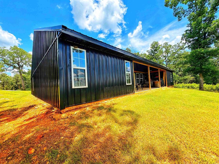 LIKE NEW & with A VIEW for MILES! This spacious 2022 built home sits on 15 acres just a few miles from downtown Hardy! Step into a modern cabin vibe with vaulted wood ceilings & SO MUCH SPACE! The kitchen island is straight out of your dreams! At 5x 14ft there is plenty of space for family & friends! Solid wood cabinets, butcher block countertops, & a walk in pantry complete the masterpiece! The gas log fireplace is framed in shiplap with built in surround sound & that wood mantle is PERFECT for your seasonal decor! All bedrooms have walk in closets! The primary en suite offers a double vanity, soaker tub & walk-in shower. Step straight out of your bedroom onto your 10x30ft back porch & enjoy the peaceful view for miles, including the Spring river.