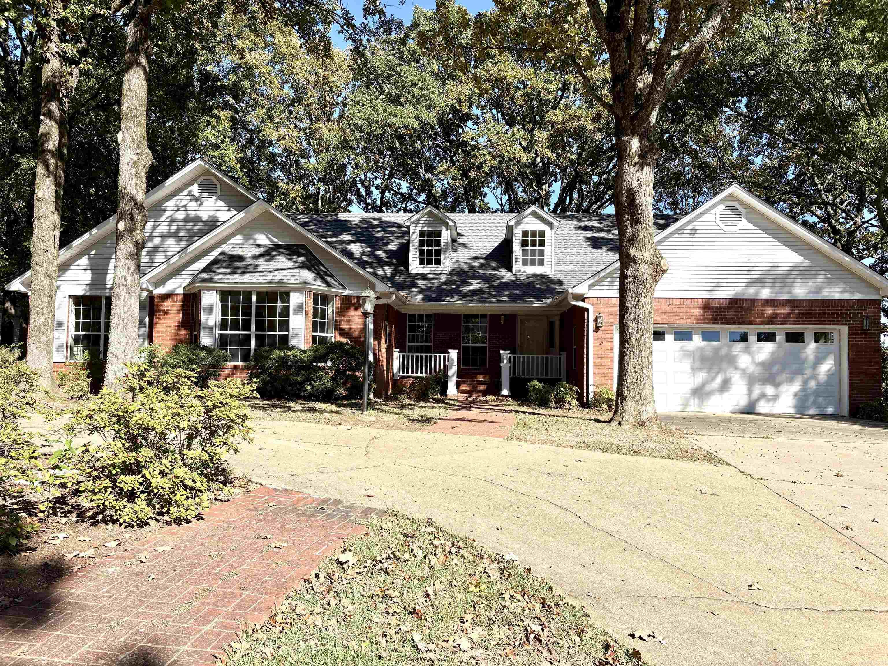 One of the few hard-to-find 5-bedroom homes on the market, this house is in the heart of River Oaks subdivision. It received a major glow-up in the summer and fall of 2025, with a new roof, all new flooring, a rebuilt oversized back deck, and fresh interior paint throughout. The two dozen trees on the lot got a professional trim and the front porch received a fresh coat of paint. Features include abundant storage, built-in bookcases, a vaulted ceiling and gas-log fireplace in the living room, French doors leading to the deck from both the living room and the kitchen, a fenced area for dogs, and a circle driveway. Double garage, sprinkler system and a great view of the nice homes downslope.