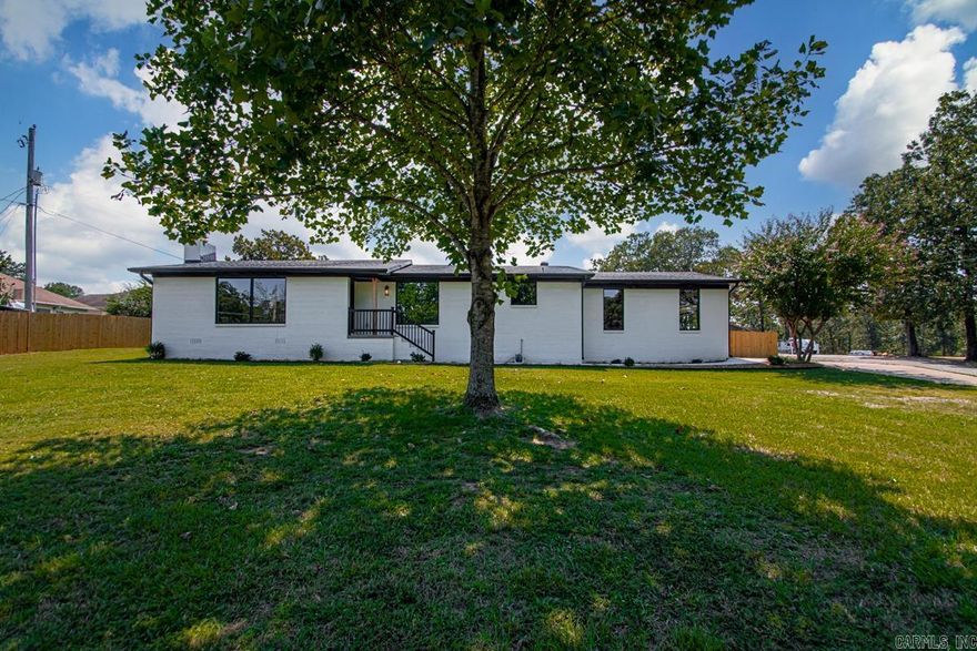 Take advantage of this rare opportunity to own a meticulously remodeled residence on a spectacular, nearly one-acre lot in the heart of Sherwood! Taken completely down to the studs, virtually everything in this 3-bedroom, 2-bathroom home is brand new. The inviting entryway opens into a spacious living room centered around a cozy gas fireplace and anchored with massive windows. This seamless flow leads to a bright dining area and a kitchen equipped with premium cabinetry and stainless-steel appliances. The split floor plan layout places two secondary bedrooms and a full bath on one wing while the private primary suite occupies its own wing. The primary features a large walk-in closet, dual-sink en-suite and a bonus sun-drenched bonus nook. A separate sunroom offers the perfect flex space leading out into a large, fully fenced back yard designed for entertaining, pets or play. Combining location convenience, a sizeable lot and fresh updates, this is a must see!