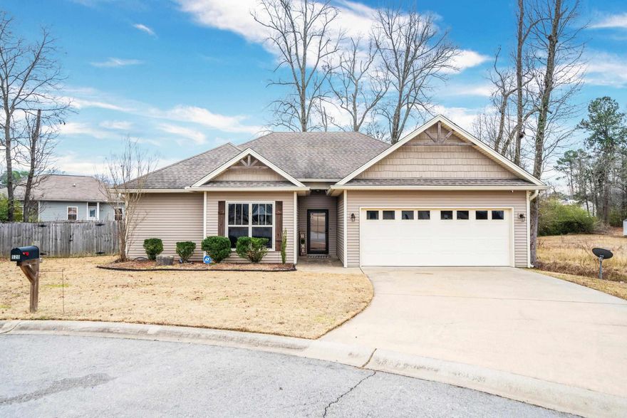 This stunning 3-bedroom, 2-bathroom residence offers a perfect blend of modern elegance and comfortable living. Step into an inviting open-concept design, where the spacious living area seamlessly flows into the dining space and kitchen, creating an ideal environment for both entertaining and everyday living. The heart of this home is the beautifully appointed kitchen featuring granite countertops, providing a luxurious touch to the space.  You'll appreciate the stylish stained concrete floors that not only add a touch of sophistication but also ensure easy maintenance and durability. The well-thought-out split floorplan allows for privacy, with the primary bedroom situated on one side of the home and the secondary bedrooms on the other. Escape to the primary suite, a spacious retreat boasting a private en-suite bathroom, offering a haven of relaxation with its spa-like ambiance. The additional two bedrooms share a thoughtfully designed second bathroom, perfect for accommodating family or guests. This home also features a convenient 2-car garage, providing secure parking and additional storage space, fenced back yard, and covered back patio. Located in a quiet cul-de-sac.