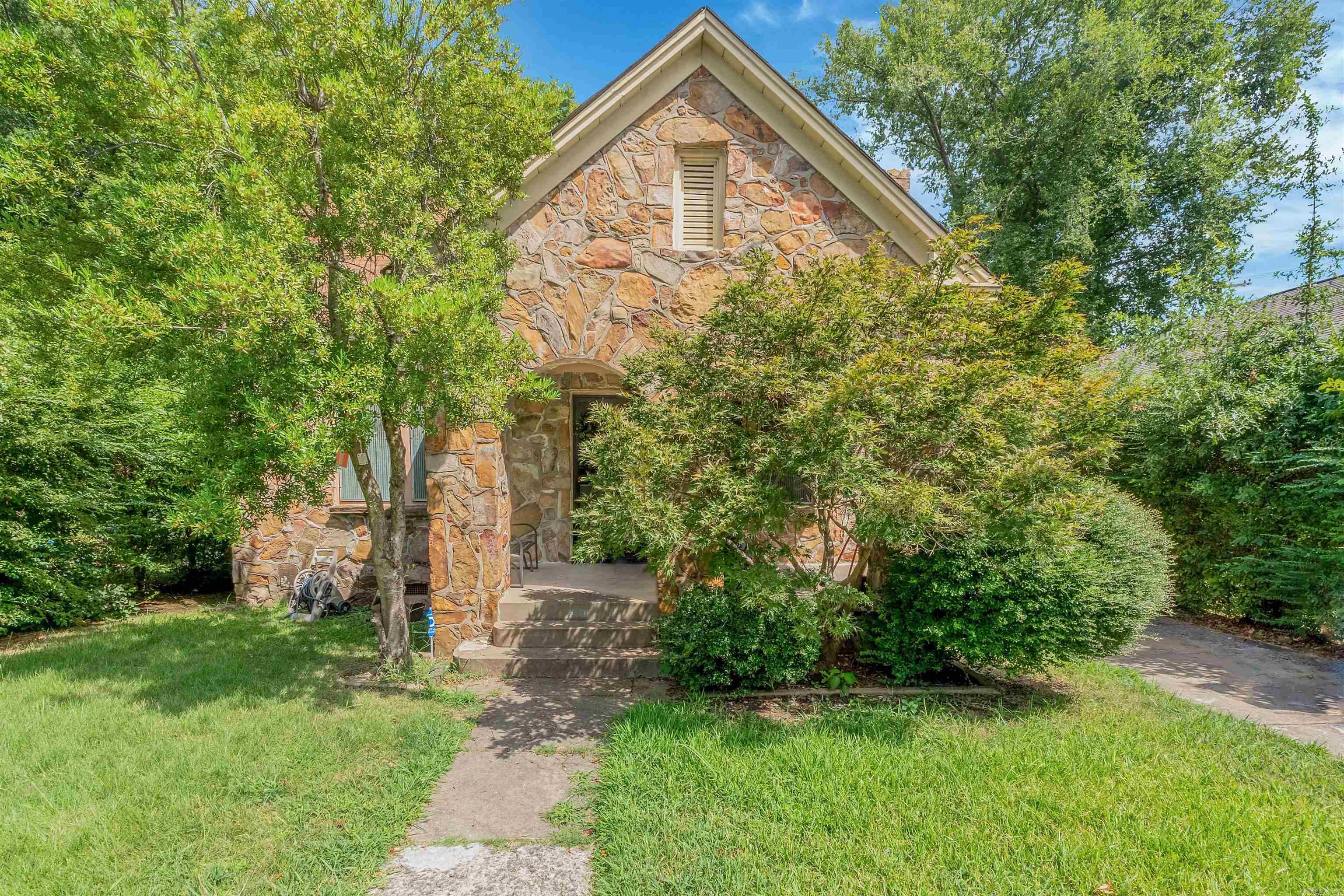 Charming 2-bedroom, 1-bath home in the historic North Argenta neighborhood of North Little Rock. Built in 1930 with 1,271 sq ft of living space, this single-level home features a masonry exterior, cozy fireplace, and mix of tile and carpet flooring. The property sits on a manageable lot with a concrete driveway, detached garage, and chain-link fence. Conveniently located just blocks from North Little Rock High School and minutes from downtown dining and shopping. Preapproval required prior to showings with a 12 hour notice.
