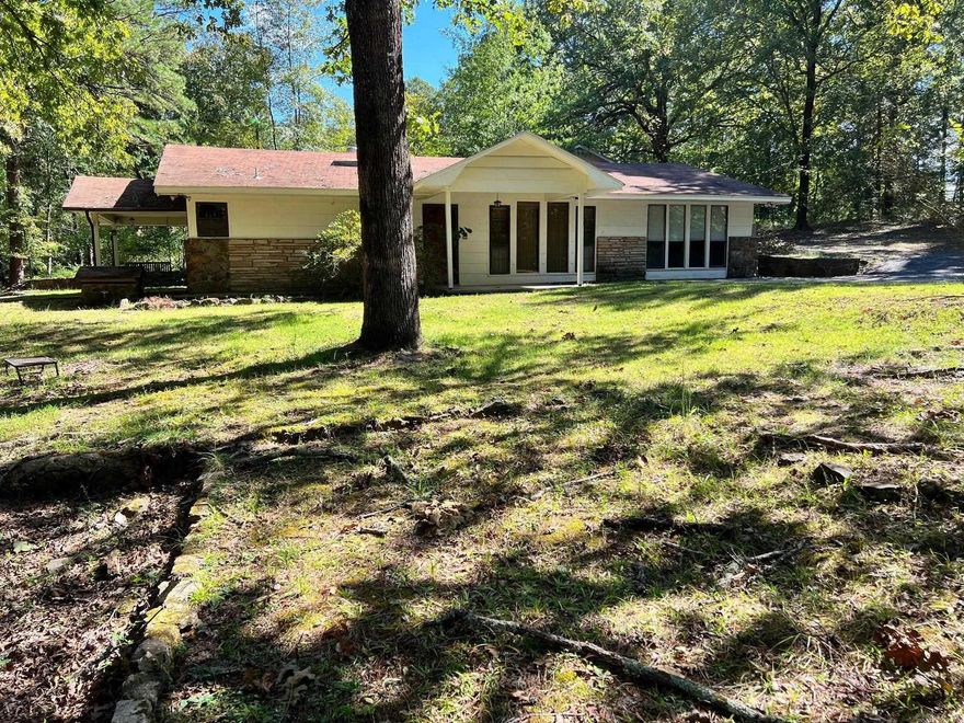 Peaceful retreat near the Little Red River with plenty of storage for your toys.  This 2 bedroom and 1 bath home features two living spaces and an additional guest house with a bedroom and bathroom. The possibilities are endless. The mineral rights will convey.