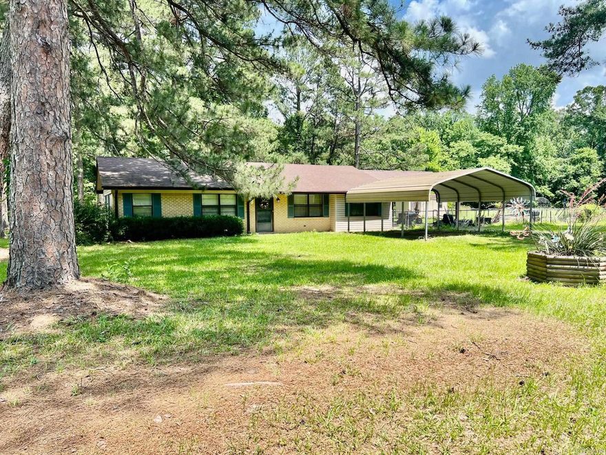 Welcome to this delightful ranch-style home nestled on a pretty, tree-lined street in the sought-after Wallace community near Foreman. This home blends classic charm with modern touches, offering comfort, style, and space both inside and out.  Step into a bright and inviting kitchen featuring designer color palettes and trendy wallpaper that add warmth and personality. The open living area flows seamlessly, creating the perfect space for relaxing or entertaining.  With three roomy bedrooms, each offering ample closet space, there’s plenty of room for family, guests, or a home office. The very large utility room is a true standout—generously sized to accommodate a washer, dryer, full-size freezer or second refrigerator, and boasts shelves galore for organized storage.  Out back, you'll love the spacious covered patio, ideal for year-round gatherings and enjoying the outdoors. The huge yard includes a charming greenhouse, perfect for gardening enthusiasts or those dreaming of growing their own herbs and vegetables.  Don’t miss this opportunity to own a beautiful home in a welcoming community with character and convenience.