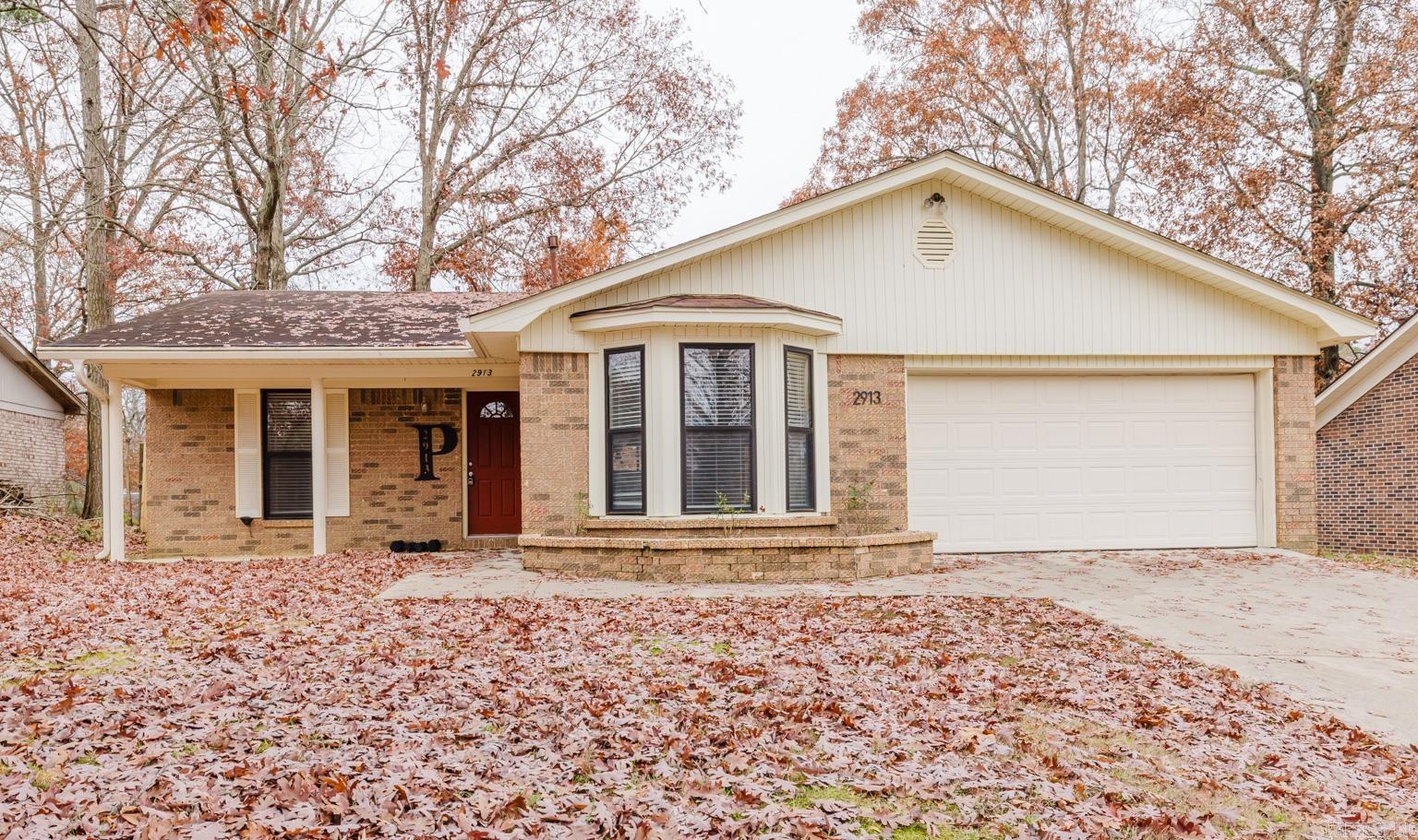 Split floor plan located in the Bryant Schools has three bedrooms, two bathrooms and a brick fireplace in the den overlooking the back yard. Enjoy meals prepared from the well appointed kitchen from the dining area with a bay window. Gas stove, granite countertops, pantry and a stainless steel refrigerator which conveys are all contained in the kitchen. Primary bedroom has a walk in closet and a private bathroom. Washer, dryer, refrigerator and a lawn mower convey with the property. All conveniently located to shopping and other amenities in both Benton and Bryant. Call your agent now for your private showing. Agents: Please see remarks.