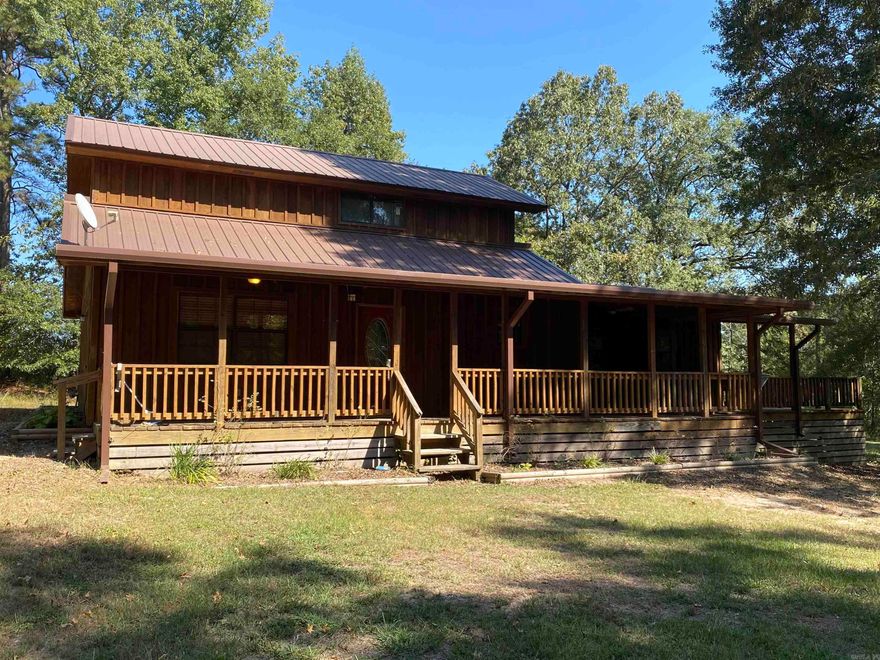 Country living, close to town with approx. 6.74 acres.  2 story log home offers over 2,000 sq ft of living space, oversized living room, kitchen with breakfast bar, 2 or 3 bedrooms, bath and 1/2 downstairs with additional bedroom, bonus room and bath upstairs.  Nice wooden deck to enjoy the great outdoors.  Property has a 40x32 shop building on a concrete slab with electricity and insulation, additional 32x30 covered shop space on back of shop.   Home is move in ready.  Contact our office for more details.