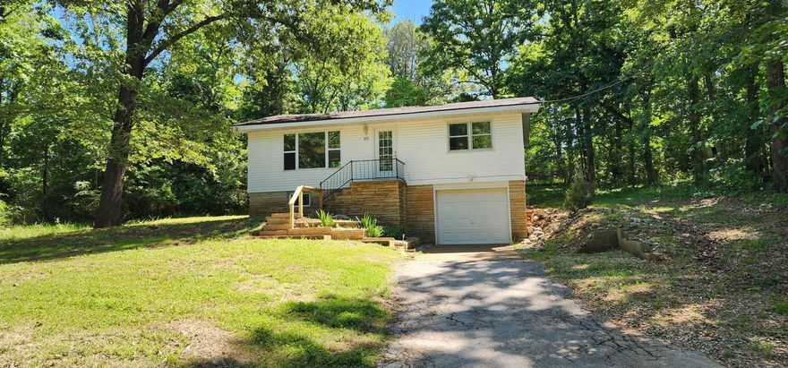 3 Bedroom  1 full bath with a bonus room.  Wood and vinyl plank floors.  Open Kitchen/dining/living room, 2 bedrooms, 1 bath on the upper level, 1 bedroom, den/bonus room and large laundry room on the lower level with an entrance from the garage.  Requires credit check/references, 1 year lease, security deposit.