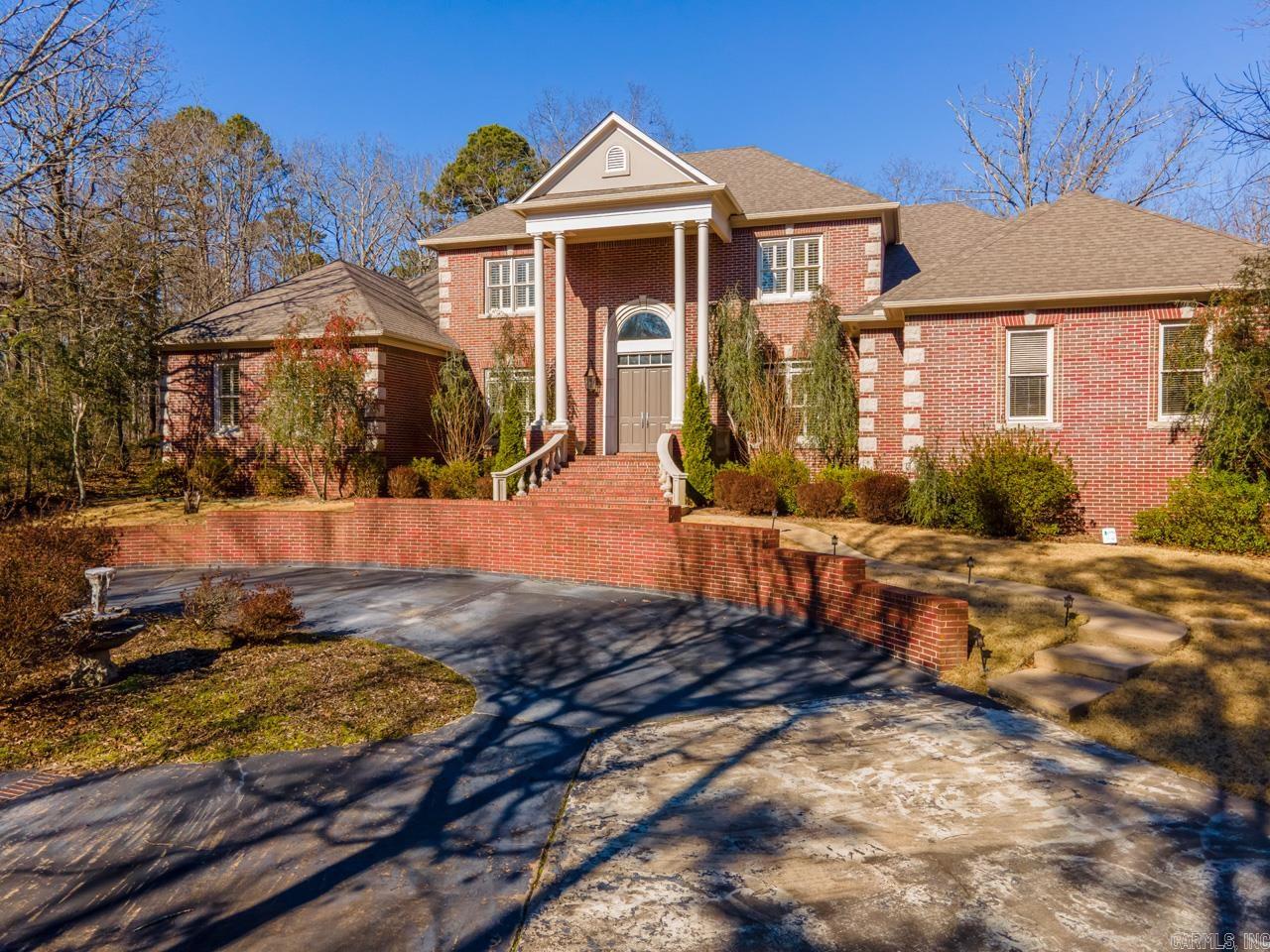 Custom home on 5 acres in a highly sought after location.  Located behind a gate on a private street at the end of the cul de sac is this well built 2 story brick home and a detached large garage/workshop with a garage door.  Built with quality in mind with 10'ceilings down, 9' up, all large rooms with extensive trim & built ins.  Each bedroom has en suite bathroom.  Enjoy privacy and space with this lovely property.  Roof and gutters 2021.  Ideal location close to Promenade, Kroger and Costco.