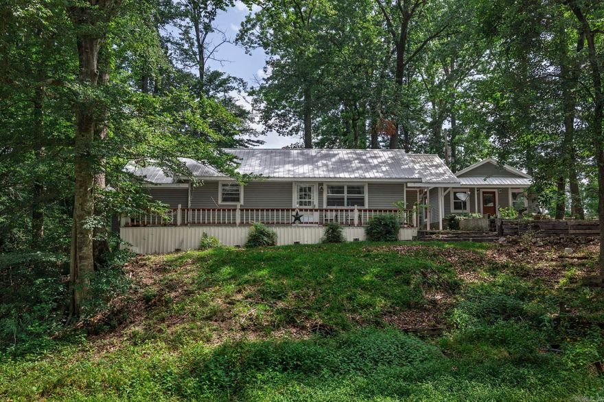 Escape to peaceful country living with this charming two-bedroom, two-bath home nestled just outside of Gurdon, Arkansas. Surrounded by nature, this property offers a serene setting next to a beautiful, flowing creek, perfect for relaxing or enjoying the outdoors. The home features brand new siding and a durable metal roof, providing both style and long-lasting protection from the elements. Inside, you’ll find a cozy loft area that makes an ideal play space or sleeping area for children. For those who need extra storage or space for hobbies, the detached three-bay garage offers endless possibilities. Whether you’re looking for a weekend getaway or a full-time country retreat, this property offers the perfect blend of comfort and rural charm.