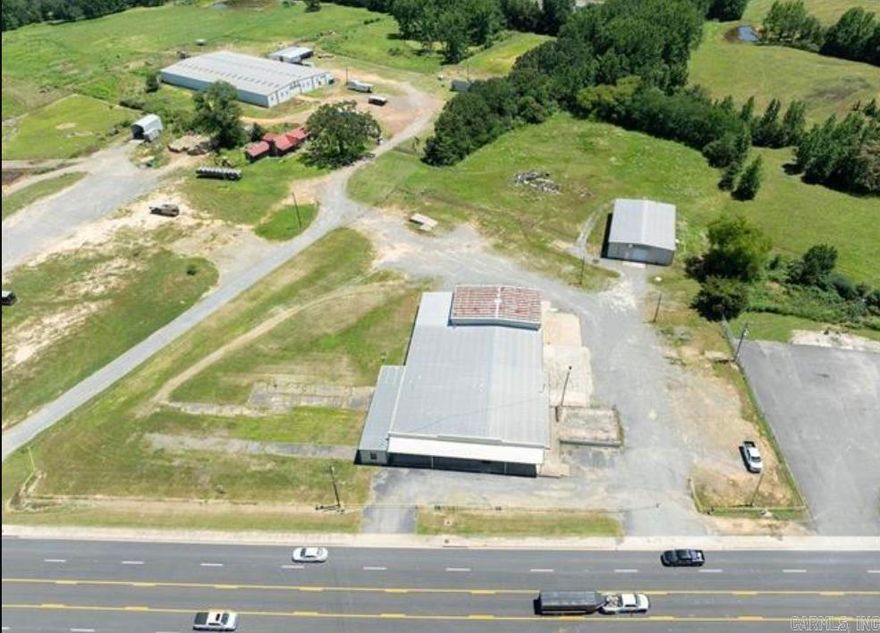Positioned directly on Highway 65, this property offers excellent visibility and accessibility for industrial users, distributors, or service-based businesses. The site features two buildings totaling over 16,000 square feet on 3.5 acres, providing flexibility for operations, storage, or future expansion.  The main building spans approximately 12,700 square feet, offering a mix of open production space, warehouse capacity, and office areas suitable for a variety of uses. A separate 3,750-square-foot warehouse adds additional storage or workshop functionality.  With ample parking, large yard space, and highway frontage, this property is ideal for businesses looking to serve Central Arkansas and beyond.