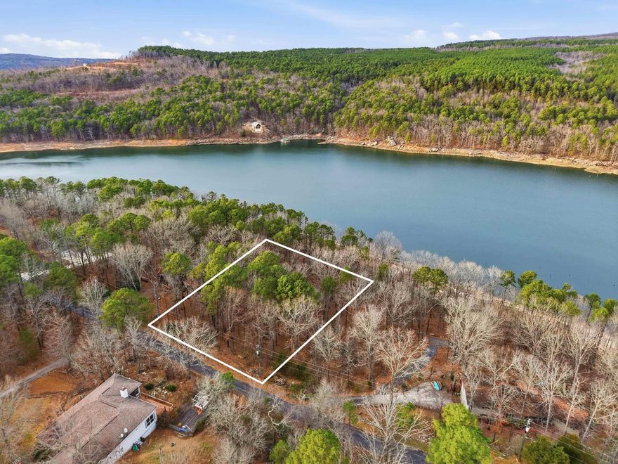 Lakefront lot in the desirable Mystic Isle subdivision on Greers Ferry Lake. Approximately 0.57 acres with beautiful lake views and direct walk-down access to the water. Ideal location for a custom lake home in a peaceful setting. Lot is builder-owned, with the option to work directly with the builder to design and build your dream lake house.