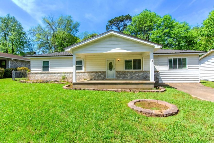 Great home close to everything.  Natural light in living room which opens to kitchen and  dining area that is open to sunroom and screened in porch.  4th bedroom could be den or family room.  3 bedrooms off hall from living room.  Primary bedroom and halp bath opposite other two bedrooms.  Backyard can be accessed through double gate off another street.  2 outside storage buildings in rear of property.  White fence panels present on property can be reattached for privacy. Posts are already in place. On dead end street so very private. Large porch in  front would be great place for swing.