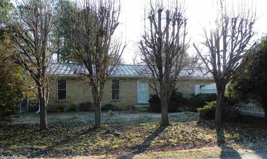 Completely renovated 3 bedroom 1.5 bath home, great for 1st time buyer or investment property. Metal roof believed less than 5 yrs old. New CHA & water heater in 2014. Laminate wood floor in living area & all bedrooms. Garage has been enclosed for more living space. Storm shelter & storage building. Fresh paint, new fixtures, sink, countertop, & shower/tub combo in full bath. SEE AGENT REMARKS