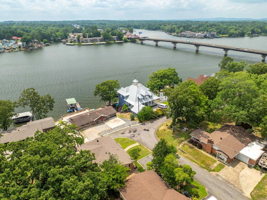 This 1,841 sq ft brick home offers million-dollar views of Lake Hamilton without the high price tag of lakefront taxes. Relax and unwind while enjoying panoramic lake scenery from the comfort of your own backyard.  Bonus income opportunity: A separate 400 sq ft efficiency apartment in walk-out basement has consistently brought in $900/month for the current owners—perfect for passive income, guests, or a private rental.  Plenty of parking available with space for a boat or up to six vehicles—ideal for lake living or hosting family and friends. New roof 12/2024. Seller will give allowance for buy-down interest rate or repair concessions of buyer's choice.