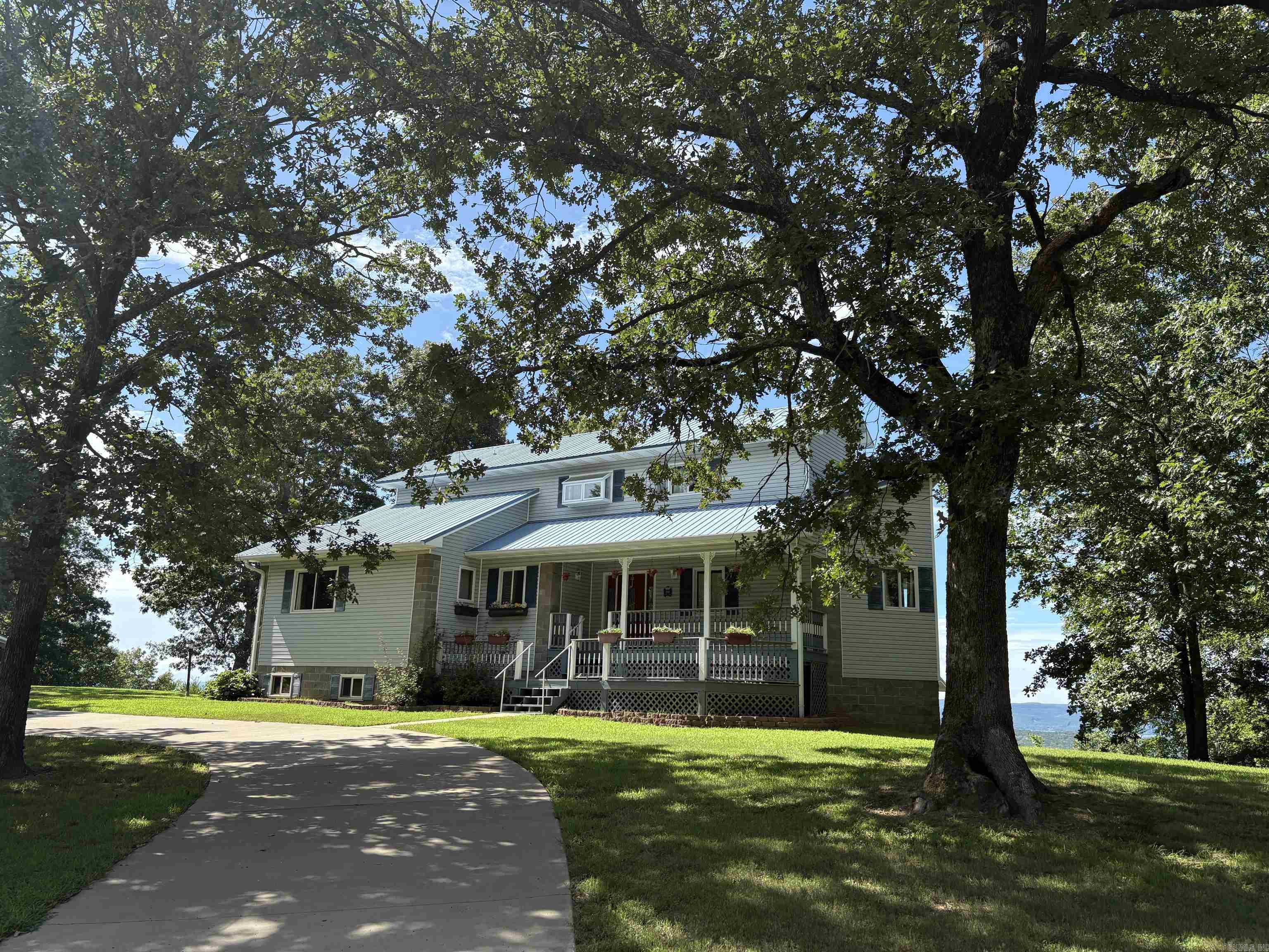 Gorgeous Lake View from every room and multiple decks! 2 Story plus walkout basement apartment with own exterior access. Elevator lift to top floor master... and best view in the home! Large detached garage/carport/shop/storage plus Exercise POOL room! Amazing AirBnB opportunity.