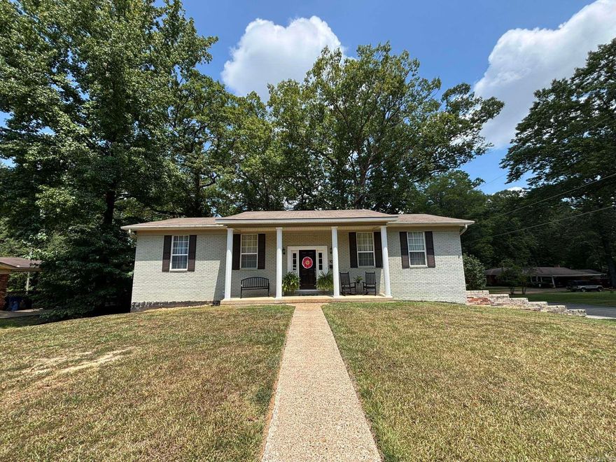 This well-maintained brick home offers an open floor plan with light, neutral colors & plenty of natural light. The kitchen is well-equipped w/ a breakfast bar & flows easily into the spacious LR/DR combo. The primary suite features double closets & a marble walk-in shower, while the hall bath boasts a marble tub/shower combo.  Enjoy two living areas—one with built-in bookcases, cabinets, & access to the rear patio. The oversized laundry/craft room provides space for hobbies, ironing, & storage, w/ washer & dryer included. A convenient ½ bath & 4th BR/guest room adjoin the den, perfect for guests or family.   The oversized double garage with openers has room for sports gear & holiday décor, while the 20x22 exterior shop/storage building makes a great he-shed/she-shed. A whole-house generator adds peace of mind during outages. This home has space, function, & extras you’ll love—don’t miss it!