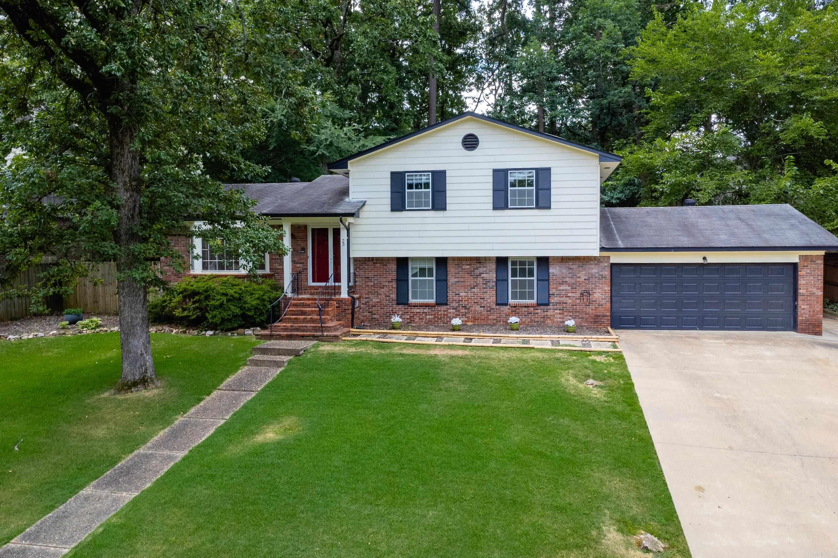 Welcome to this spacious 4 bedroom, 3 full bath home nestled in the coveted Pleasant Valley Neighborhood. The home is located only blocks from the Pleasant Valley Country Club, and the HOA fees provide unlimited access to both PV pools, perfect for hot summer days and weekend fun! Step inside to soaring vaulted ceilings and a bright, open layout with bamboo flooring in the main living spaces, upstairs bedrooms and downstairs den creating a warm and inviting atmosphere. The kitchen features durable tile flooring, new countertops, newer dishwasher and the fridge will convey. This home offers flexibility with two potential primary suites--one on the upper level and another on the lower level, which is currently functioning as the primary bedroom and features brand new carpet (the only carpeted room in the house). Downstairs there is a spacious den with a fireplace and wet bar, perfect for entertaining. The exterior of the home was painted in 2021 and the HVAC system has been well maintained. With new French doors leading to the backyard from the dining area, two generous living areas, a 2 car garage, PLUS an extra parking pad. Don't miss your chance to own in PV!