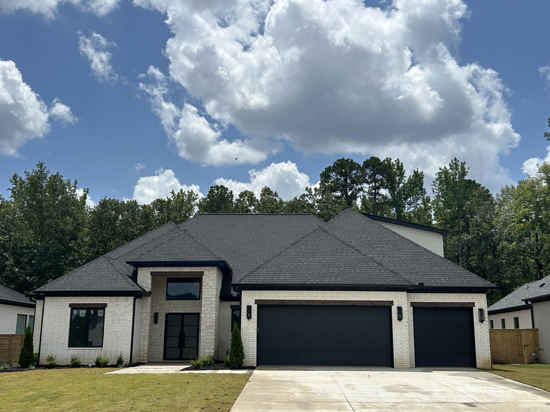Located in Chenal Valley’s exclusive Abington Court, this stunning white brick home with stone accents blends timeless curb appeal with thoughtful, high-end design. Step inside to a bright, open floor plan featuring beautiful ceilings and a statement fireplace that anchors the main living space. The spacious kitchen is ideal for everyday living and entertaining, with a large walk-in pantry and stylish finishes throughout. The primary suite is a true retreat, offering a generous layout, a luxury bath with a spa-style shower, and a smart connection to the laundry room and mudroom for added convenience. With five bedrooms and five full baths, the home offers comfortable living for families and guests. Enjoy the outdoors year-round with a covered patio, complete with an outdoor kitchen and plenty of space for gathering. Beautiful luxury vinyl plank flooring and abundant natural light complete this warm, welcoming home.
