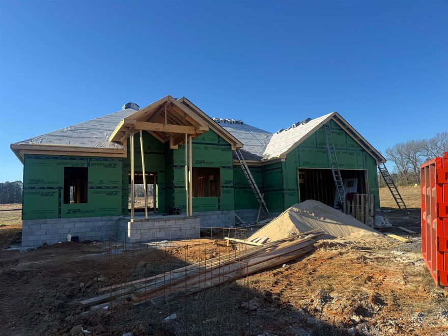 Discover this beautifully crafted new construction by Jacob Moix Construction nestled on a peaceful cul-de-sac in Windridge Estates. This 4 bedroom, 2 bath home offers 2,001 sq ft of smartly designed living space with a split layout that provides privacy and functionality. The open living, dining, and kitchen area creates a warm, inviting space perfect for gathering, entertaining, or relaxing at home. Thoughtful finishes, modern style, and energy-efficient construction make this home both stylish and easy to maintain. The primary suite is a true retreat with a spacious bath, while the additional bedrooms offer flexibility for guests, family, or a home office. Step outside to the covered patio and enjoy the level backyard—ideal for quiet evenings or weekend get-togethers. Conveniently located with quick access to Hwy 67/167, making commutes to Little Rock, North Little Rock, and Searcy a breeze. Just minutes from Cabot schools, shopping, dining, parks, and the Cabot Community Center.