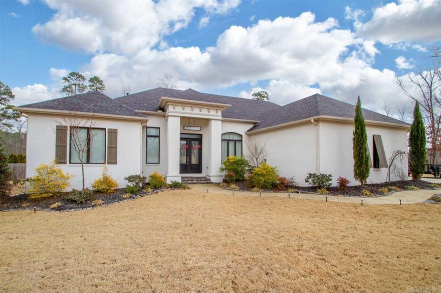 Beautiful custom home with pool on almost 1 acre in cul-de-sac. Contemporary style w/designer colors and stainless light fixtures. Living room w/fireplace. Eat-in kitchen with large pantry and separate ice machine is open to the hearth room. This home offers an office and safe room. The master has a huge walk-in closet. The oversize laundry room has lots of cabinets. The in-ground pool is surrounded by stained concrete and extra landscaping. Entire lot has sprinkler system. Green space behind home.