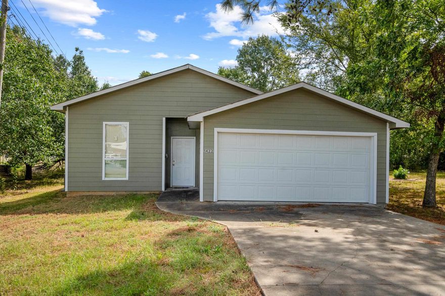 Step into Comfort and Style! Discover modern living in this spacious 2-bedroom, 2-bath home designed for ultimate comfort and style. Enjoy a well-appointed kitchen featuring sleek stainless steel appliances, and updated bathrooms with contemporary finishes. The tall ceilings throughout create an open, airy feel. Additional features include an attached garage and extra concrete parking for your convenience. Located close to businesses and amenities, this home perfectly blends convenience with modern design. Don’t miss out—schedule your showing today!
