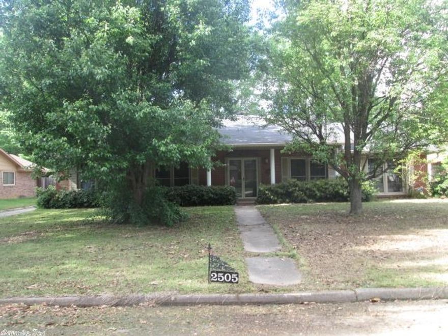 Large brick home with three bedrooms and three baths on one level. Two living areas with brick fireplaces. The back part of the home could be used as an in law quarters as there is a second kitchen. This is a wonderful home for a growing family