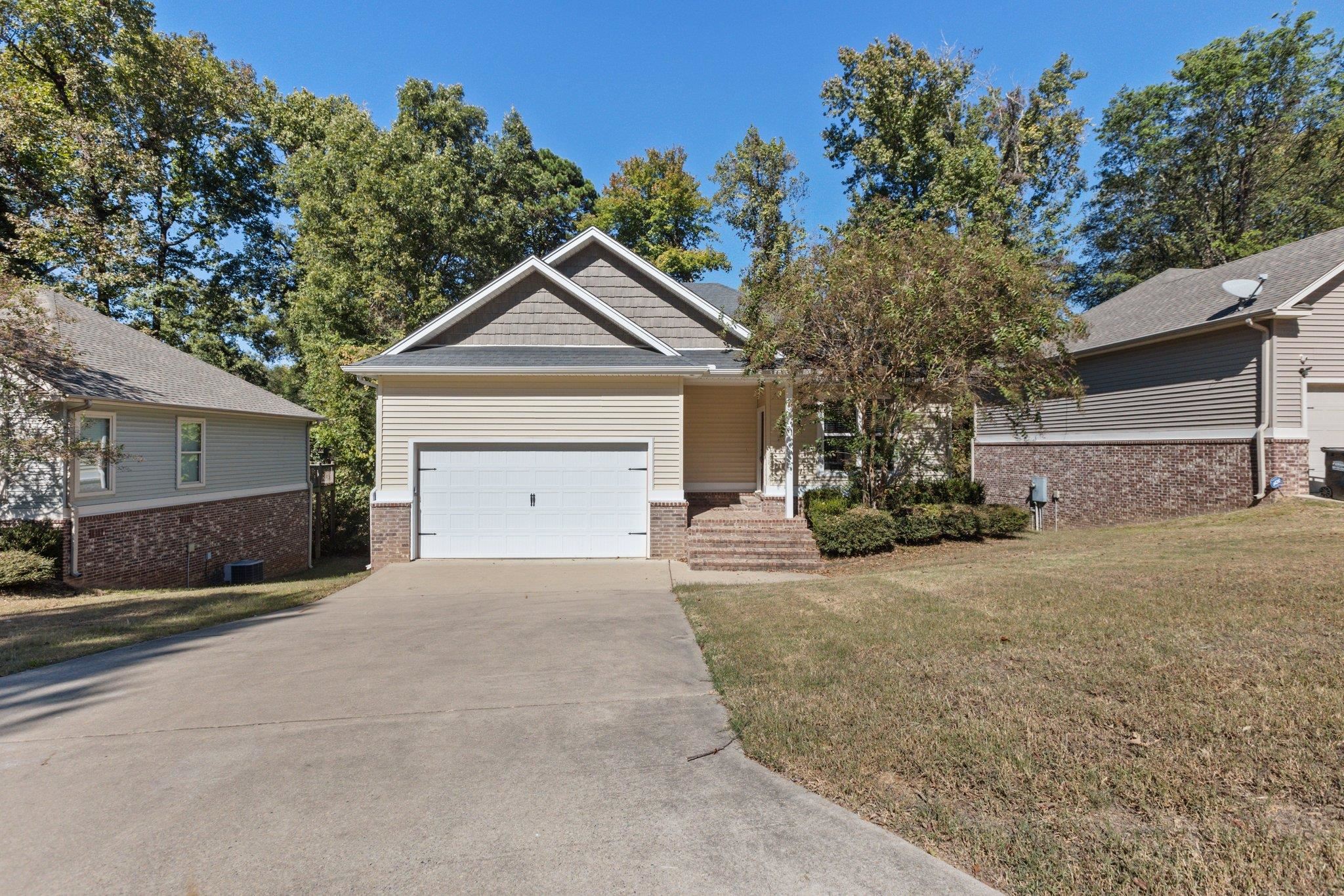 Check out this custom "like new" Schrader built home in the heart of in the heart of Benton. This home sits on a nice lot towards the end of the cove which provides safety and privacy. The home has been gently lived in and has a custom trim package, granite counters, beautiful flooring and much more . As you walk out back you will love the shaded deck with all of the trees and green space. This awesome house will not last long so hurry and schedule a VIP showing.